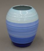 A Shelley blue ground porcelain vase. 18 cm high.