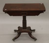 An early 19th century mahogany folding card table. 87 cm wide.