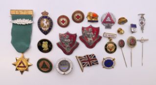 A quantity of badges and pins, to include: two St Christopher's College badges,