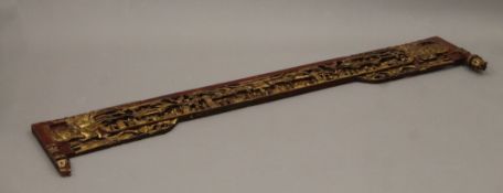 A Chinese gilt wood wall hanging. 186 cm long.