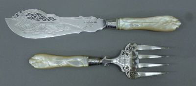 A pair of Victorian silver and mother-of-pearl fish servers. The fork 21.5 cm long. 244.