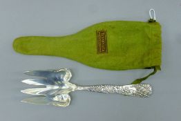 A Tiffany & Co silver serving fork in original felt bag. 24 cm long. 135.2 grammes.