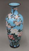 A 19th century Japanese turquoise ground cloisonne vase decorated with flowers. 46 cm high.