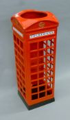 A metal stick stand in the form of a telephone box. 57 cm high.