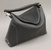A Peter Kent leather handbag. 38 cm wide.