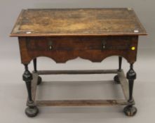 An 18th century walnut single-drawer side table. 85 cm wide.