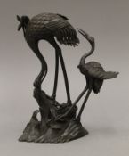 A 19th century Japanese bronze of two cranes on rockwork. 25 cm high.