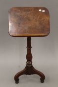 A 19th century mahogany tripod reading table. 45 cm wide.