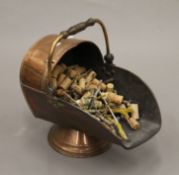 A Victorian copper coal scuttle. 32 cm high.
