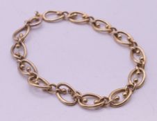 A 9 ct gold bracelet. 18.5 cm long. 8.2 grammes.