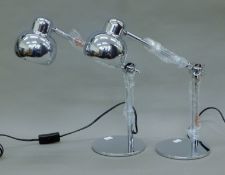 A pair of chrome desk lamps, each base 15 cm diameter.