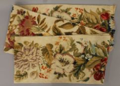 An early 20th century cross stitch floral panel. 28 x 256 cm.