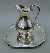 An Elkington & Co silver-plated jug and a James Dixon & Sons silver-plated salver.