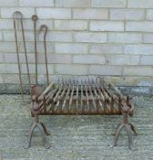 A fire grate with accessories. The grate 52.5 cm wide.