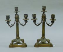 A pair of bronze candelabra. Each 35 cm high.