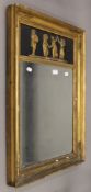 A Regency gilt mirror decorated with a figural panel. 53.5 x 81 cm.
