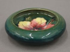 A small Moorcroft porcelain dish. 11 cm diameter.