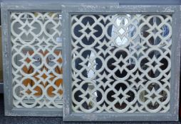 A pair of Moroccan-style grey and white painted mirrors. Each 65 cm square.