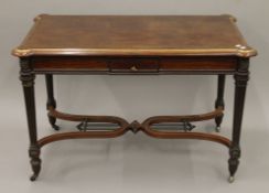 A 19th century brass-mounted mahogany centre table. 117 cm long.