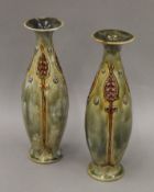 A pair of Royal Doulton porcelain vases. Each 27 cm high.