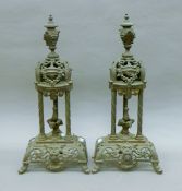 A pair of 19th century brass fire dogs. Each 50 cm high.
