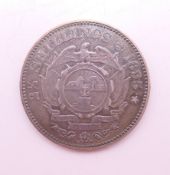 An 1895 South African silver 2 1/2 shillings coin.
