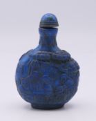 A lapis lazuli snuff bottle and stopper. 9 cm high.