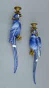 A pair of metal-mounted blue and white porcelain parrot form wall sconces. 46 cm high.
