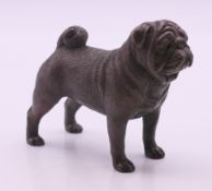 A bronze pug dog. 6 cm high.