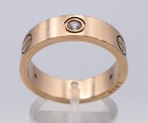 A jeweller 's sample Cartier love ring with Cartier interior markings, in box. Ring size T/U.