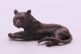 A bronze lion. 7 cm long.