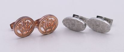 Two pair of cufflinks stamped 'Rolex', one in a Penrose of London box, both with certificates.
