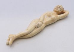 A doctors bone model of a nude female. 13 cm long.