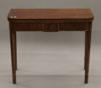 A 19th century mahogany folding tea table. 90 cm wide.