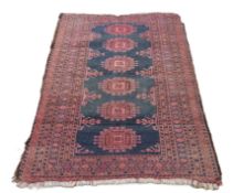 An Eastern green ground rug. 174 x 102 cm.