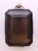 A silver and smoky quartz pendant. 3 x 2.5 cm.
