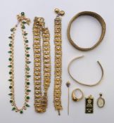 A quantity of yellow metal jewellery, to include a matching choker and bracelet, a necklace, a ring,