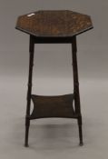 A Victorian octagonal oak side table. 43 cm wide.