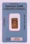 A 5 gram fine gold bar. The bar 2.2 cm high.