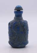 A lapis lazuli snuff bottle and stopper. 8 cm high.