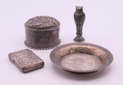 A small silver dish, a silver lidded box, a silver vesta and a silver owl seal. Owl seal 5 cm high.