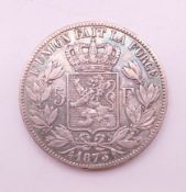 An 1873 Belgian silver 5 francs coin.