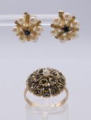 An unmarked gold sapphire and seed pearl ring and a pair of seed pearl and sapphire earrings.