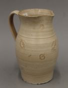 A Susie Cooper pottery jug. 22 cm high.