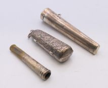 Two silver cheroot holder pendants, and a silver mounted cheroot in leather case. 8 cm high, 5.