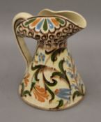 A 19th century pottery jug. 21 cm high.