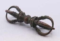 A bronze vajra. 9.5 cm long.