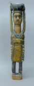 A carved wooden tribal figure. 65 cm high.