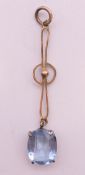 A 9 ct gold and aquamarine pendant. 4 cm high.