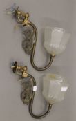 A pair of brass wall light fittings,